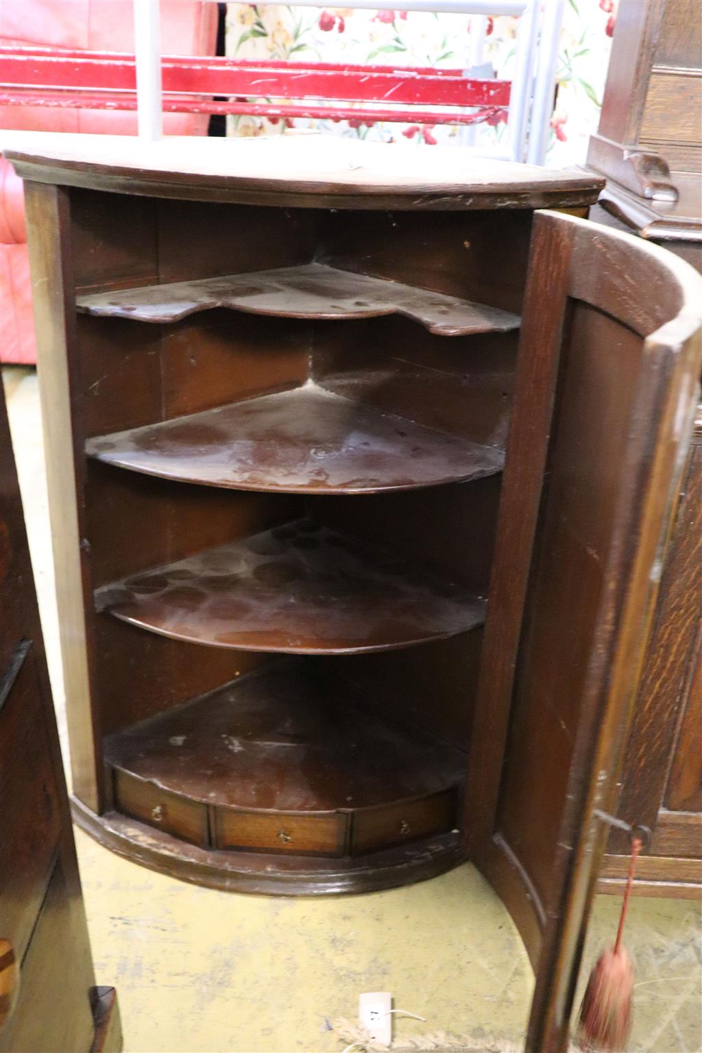 A George III walnut bowfront hanging corner cabinet, width 62cm, depth 42cm, height 88cm